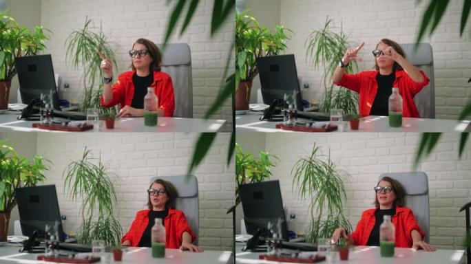 女商人使用智能眼镜并在办公室工作