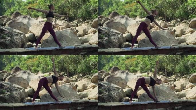 女孩做瑜伽三角体式木桥瀑布自然快速慢动作