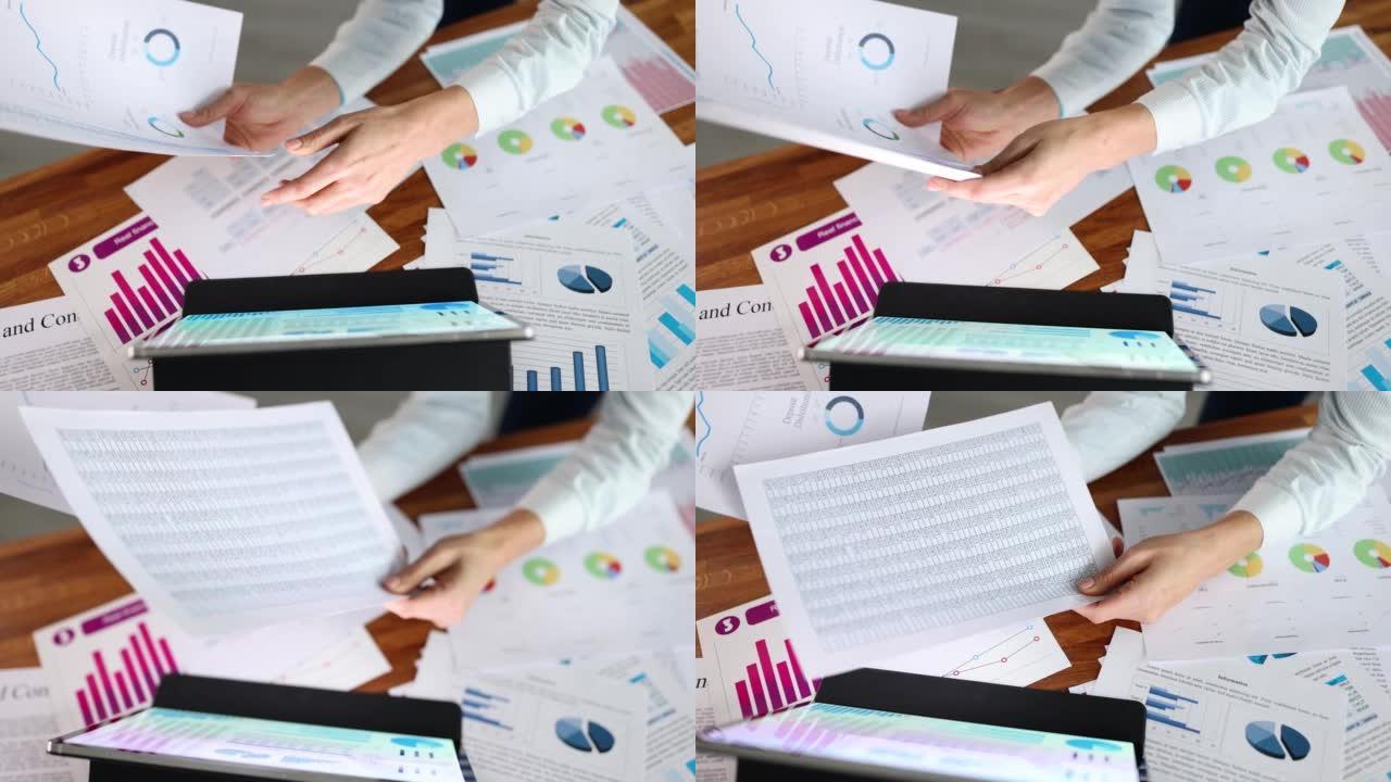 女人用图表和文件特写在数字平板电脑上研究数据