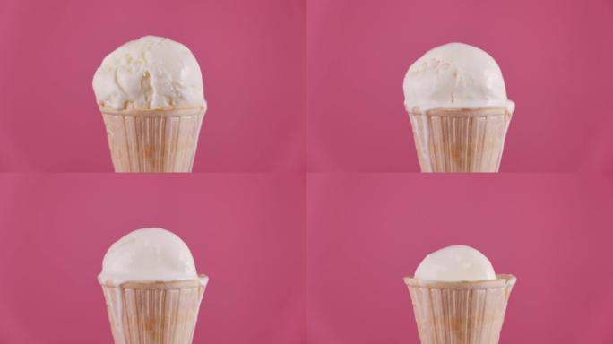 香草冰淇淋在华夫饼筒融化在粉红色背景。甜点