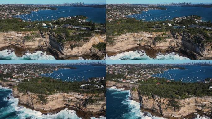 东悉尼屈臣氏湾的空中无人机视图，沿着悬崖顶向南行驶