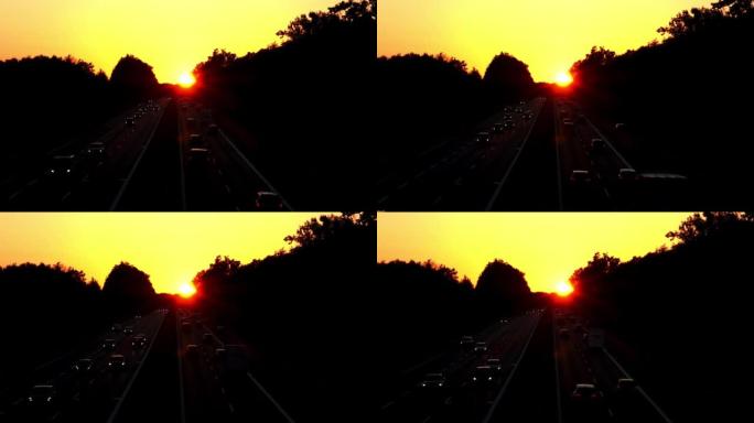 日落时高速公路上的汽车交通