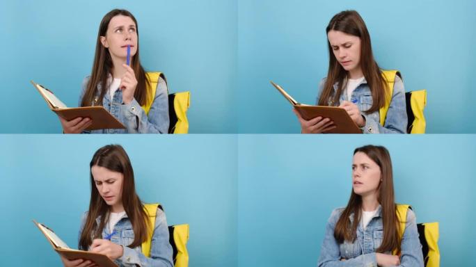肖像激怒的少女学生穿着牛仔夹克和黄色背包，在练习册笔记中写下，在工作室里孤立地摆在蓝色背景上。大学学