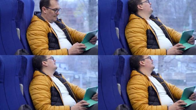 戴眼镜的成熟积极人物的个人资料肖像，戴着眼镜，看着社交媒体，坐火车回家时使用平板电脑发短信。高质量4