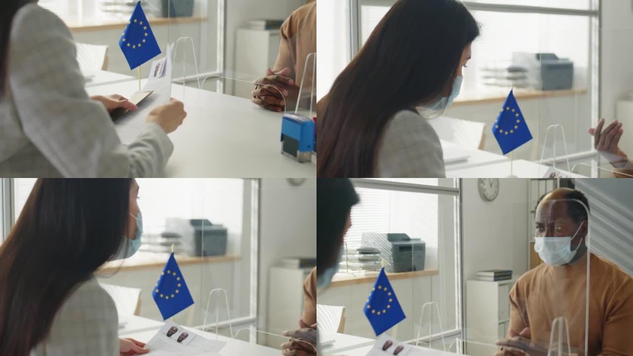 戴口罩的签证申请人在疫情期间访问欧盟大使馆