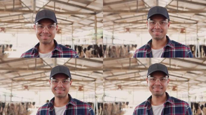 站在农场里的男性农民的肖像。男人看着相机微笑。