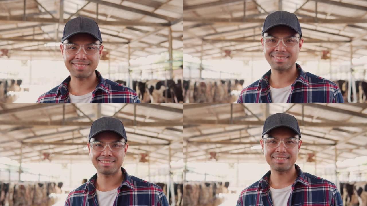 站在农场里的男性农民的肖像。男人看着相机微笑。