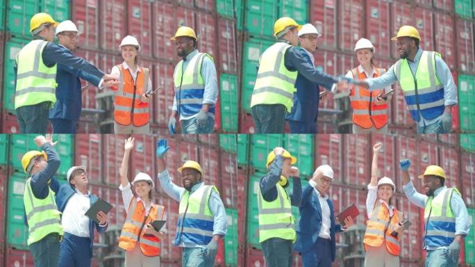 一组货物集装箱工人团队携手共进，为工作场所项目的成功而欢呼，以一堆集装箱为背景