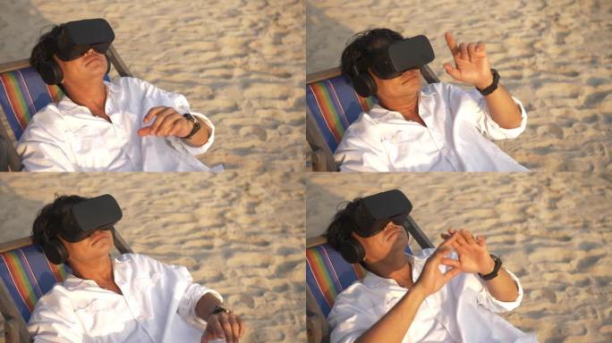 亚洲男子在海滩上放松时戴着虚拟现实眼镜。