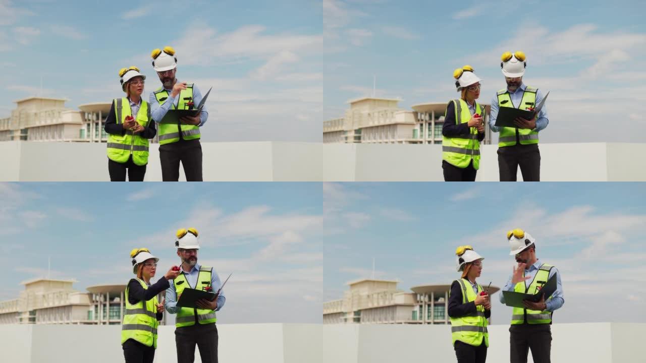 两名维护工程师男女检查在建筑物露台上的工作，维护建筑物中的空调系统