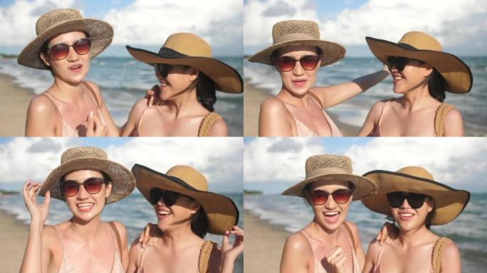 4k视频片段的快乐女性视频在海滩上打电话给他们的朋友
