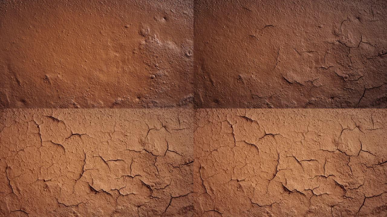 裂开的土壤的延时，在时光倒流中干燥沙漠中的棕色粘土地面。土壤中的裂缝。侵蚀、气候变化和全球变暖的概念