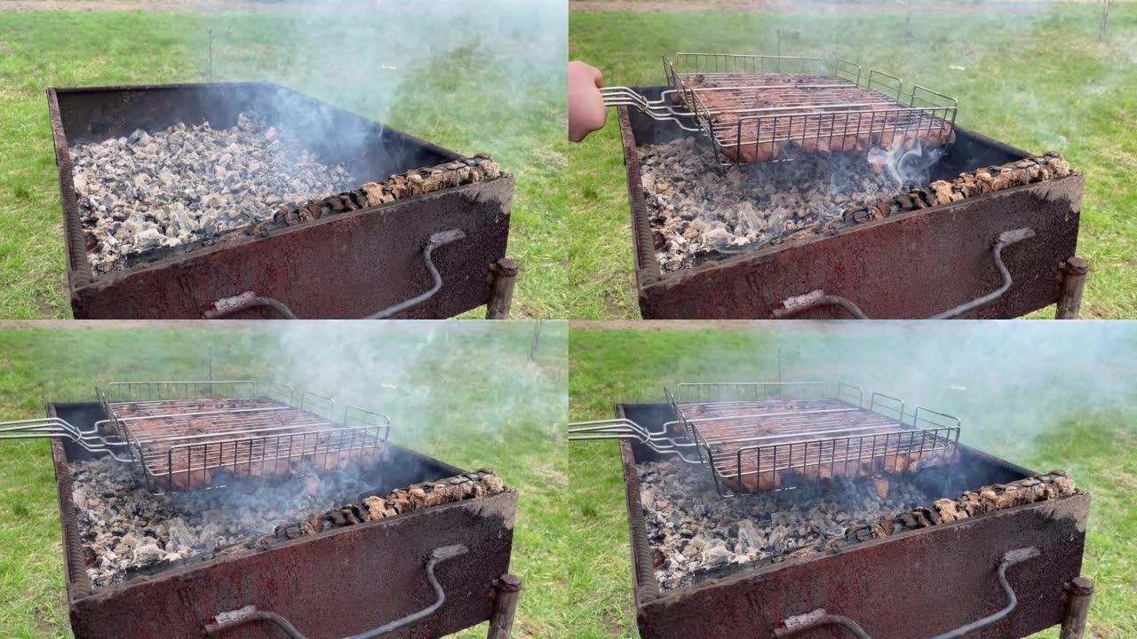 烧烤盘特写。烧烤烤肉。木炭熟肉。烧烤金属串上的美味食物。野餐概念的时间到了。美食节。猪肉在火刑柱上。