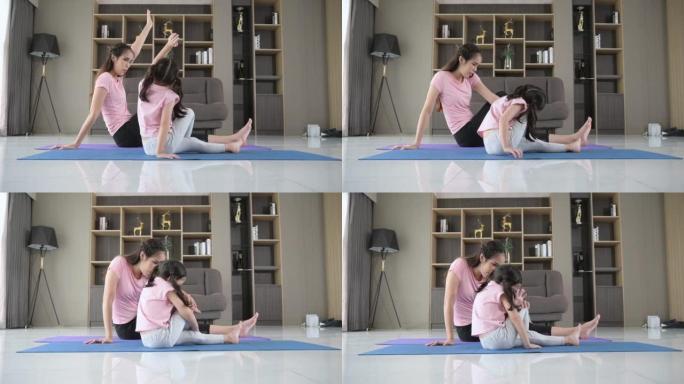 Mother and daughter exercises with yoga activity i