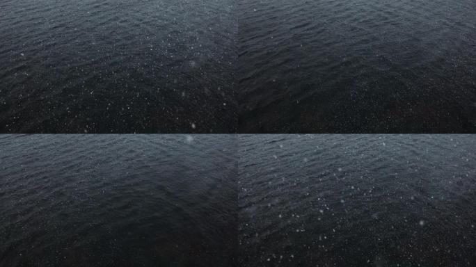 海水上的大雪暗色调大海北欧风光缓缓飘落