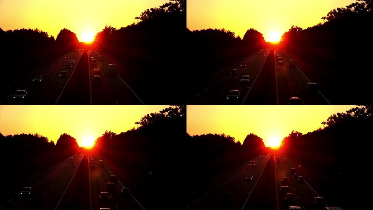 日落时高速公路上的汽车交通