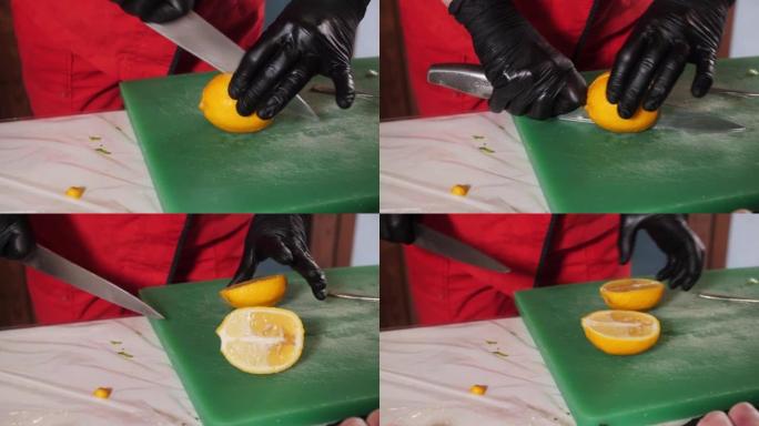 厨师在厨房的烹饪板上用刀切黄柠檬。用刀煮手切多汁成熟的柠檬做饭。