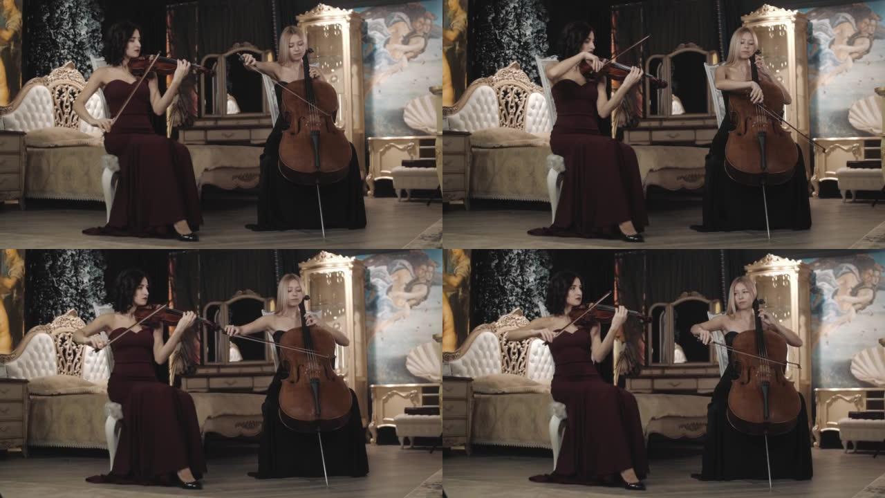 交响乐二重唱。两个女孩在美丽的舞蹈中演奏小提琴和大提琴。小提琴和大提琴。管弦乐队。