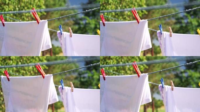 Wet Clothes and Towel Drying on Laundry Line in Ba