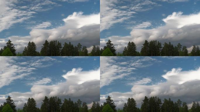 雷雨过后的乌云在森林的背景下慢慢飘过天空，实时镜头，雷雨过后的天空，4k自然的水平视频