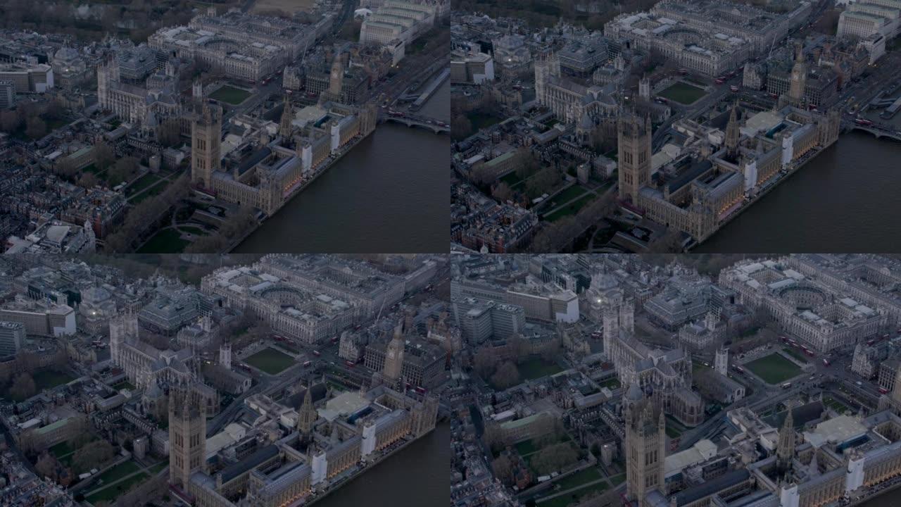 威斯敏斯特教堂和议会大厦的鸟瞰图，伦敦，英国黄昏。4 k
