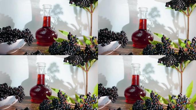 接骨木药，鲜榨红莓汁装在瓶子里。黑莓顺势疗法