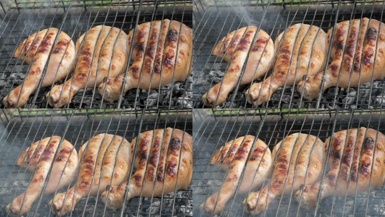 烤架上的Chiken腿。烤鸡肉特写。美味的牛排，热烧烤烤辣椒，烧烤