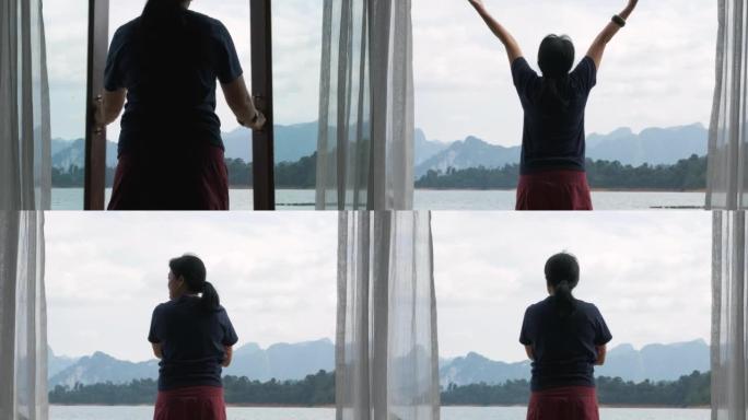 亚洲妇女敞开大门，在度假胜地欣赏山景和湖景