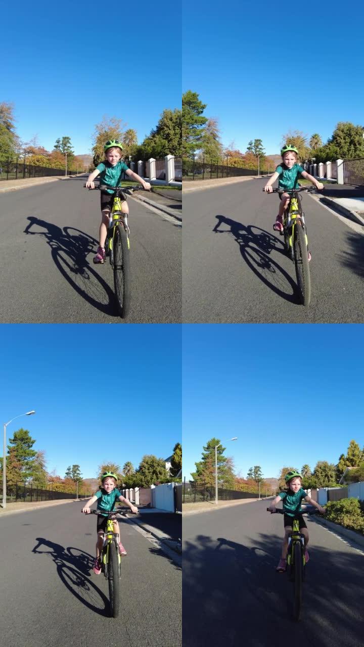 年轻女孩骑在山地自行车上的垂直视频