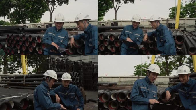 金属工业 -- 两名亚洲同事聊天，用技术检查一般球墨铸铁管库存