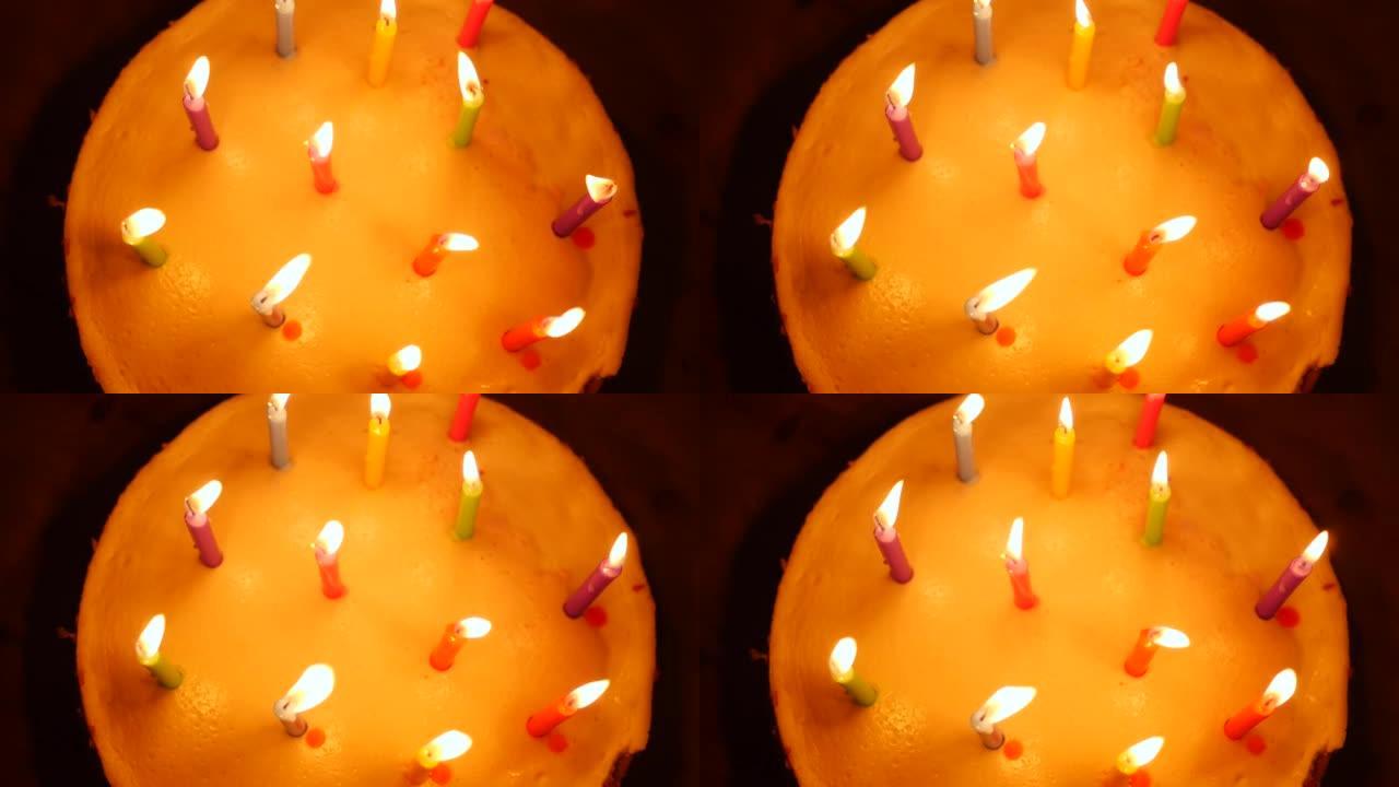 顶视图小女孩在生日蛋糕上吹灭蜡烛在家庆祝慢动作