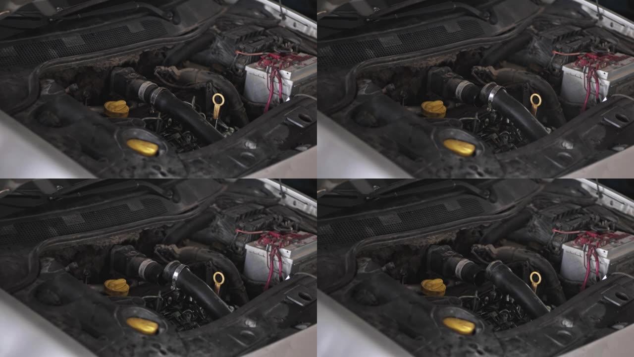 有故障的汽车发动机的流体软管在修理厂的断裂力矩