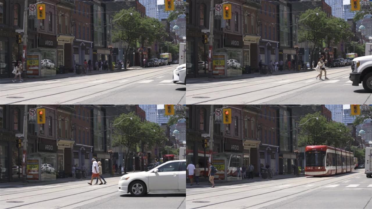 加拿大多伦多，视频-阳光明媚的日子里，皇后街西的城市生活
