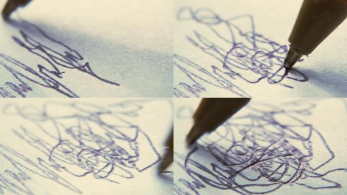 一个孩子画画的特写镜头。蹒跚学步的孩子用笔在纸上涂鸦。涂鸦作业