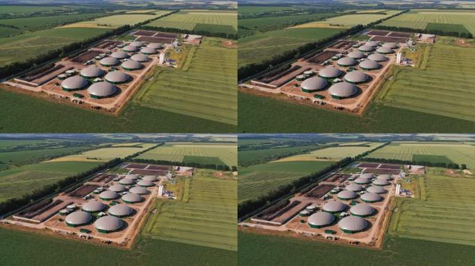 现代农业沼气厂生产节约了剩余能源。位于田间的技术工厂。鸟瞰图。