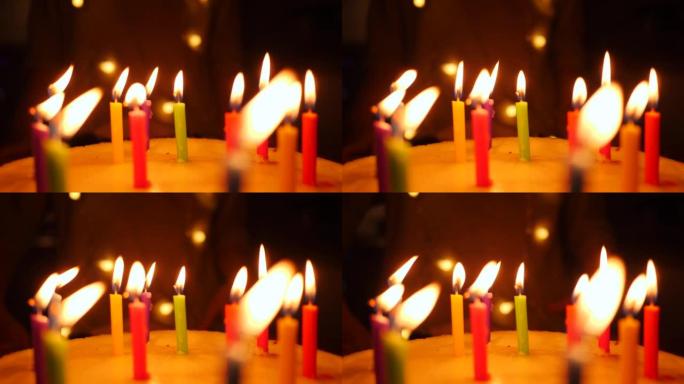 可爱的小女孩喜欢在生日蛋糕上吹灭蜡烛，在家庆祝慢动作