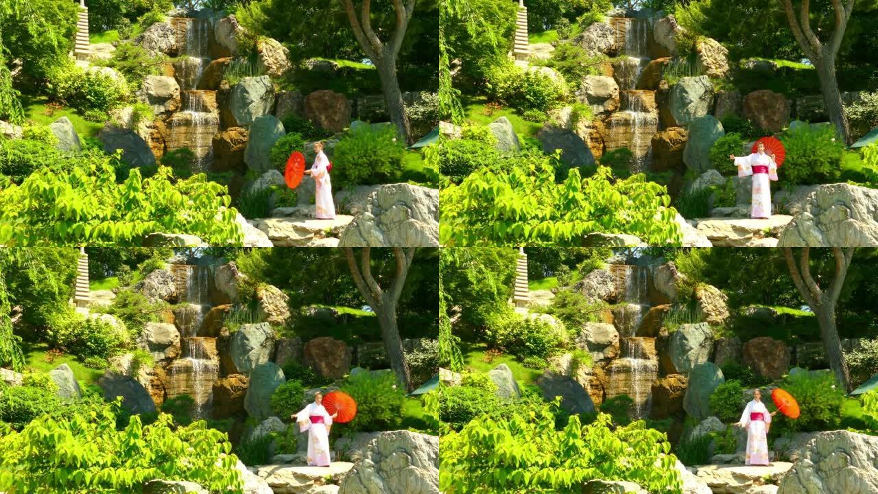 风景-在瀑布附近的日本花园中穿着和服的美女