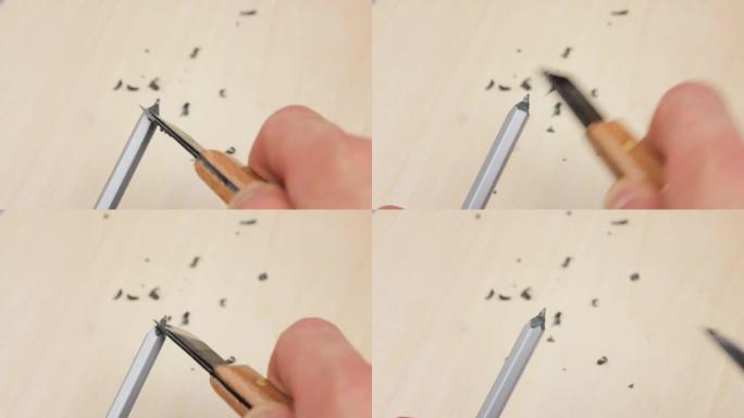 用刀削笔特写。用刀剪铅笔。