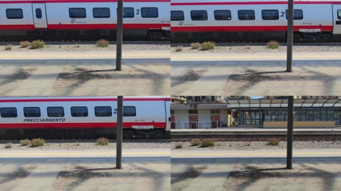 火车在铁轨上行驶。火车经过卡拉布里亚 (Calabria) 的Via站。新火车在铁路道口乘坐夏天。美