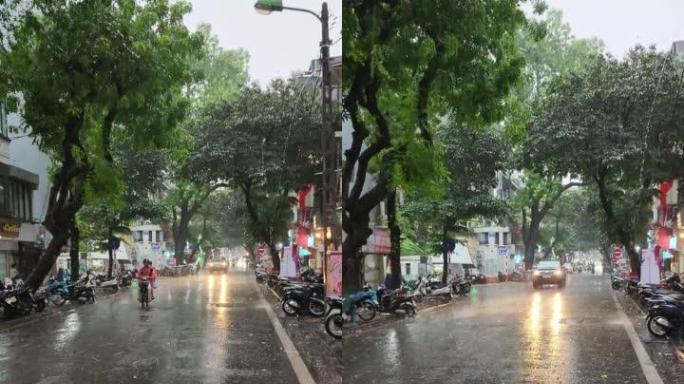 越南河内Hoan Kiem拥挤的交通混乱，许多人在暴雨中