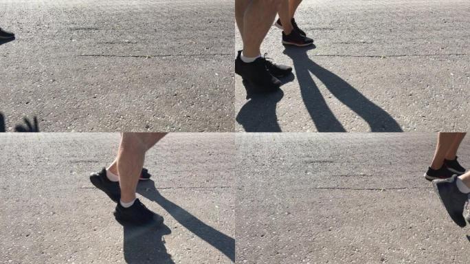 人们在阳光明媚的日子里走在夏天的路上，穿着鞋子，双腿特写。行动缓慢。莫斯科，俄罗斯-2022年6月2