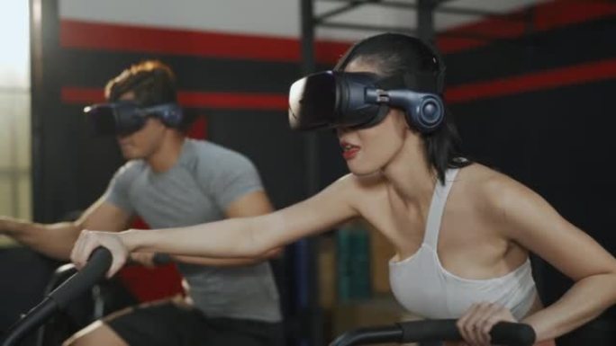 亚洲男女戴VR耳机骑自行车