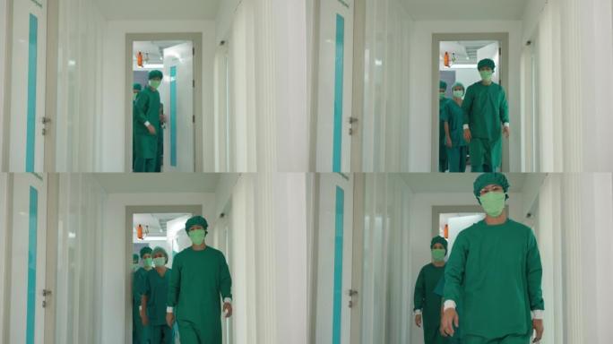 前视图外科医生和助手走出手术室。慢动作