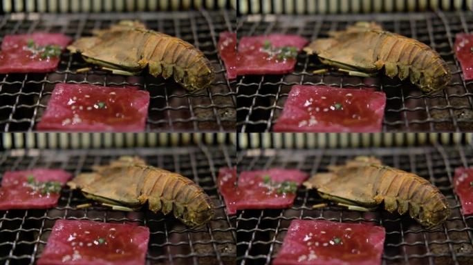 炭炉上的螳螂虾和烤和牛牛肉