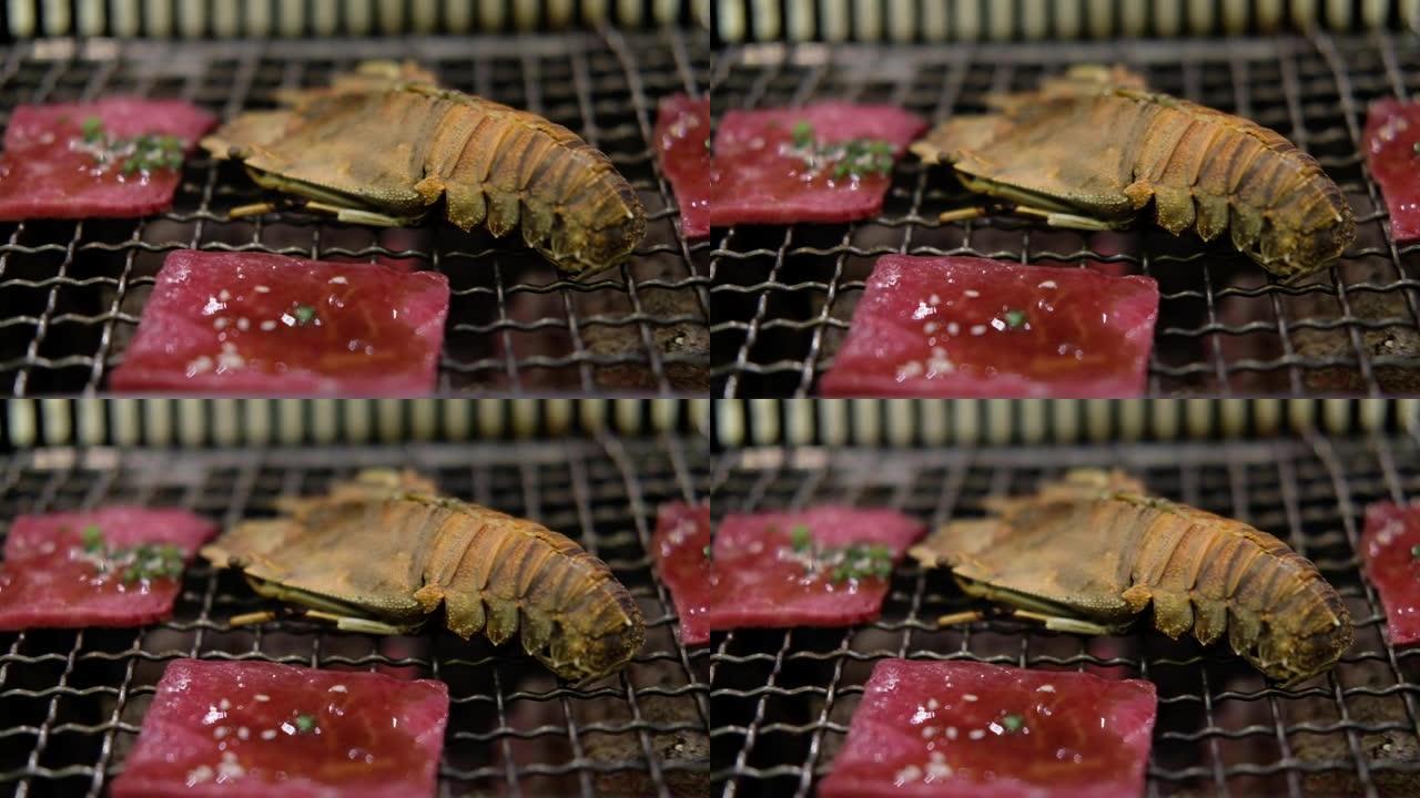 炭炉上的螳螂虾和烤和牛牛肉