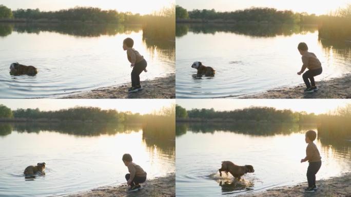 小男孩站在河岸上，在水中扔石头