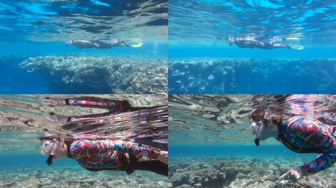 Woman in diving equipment swimming on the surface 