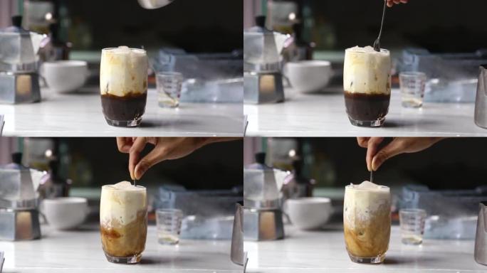 奶油牛奶，将冰咖啡制成透明玻璃杯，搭配意大利摩卡壶咖啡在柜台厨房视频4K
