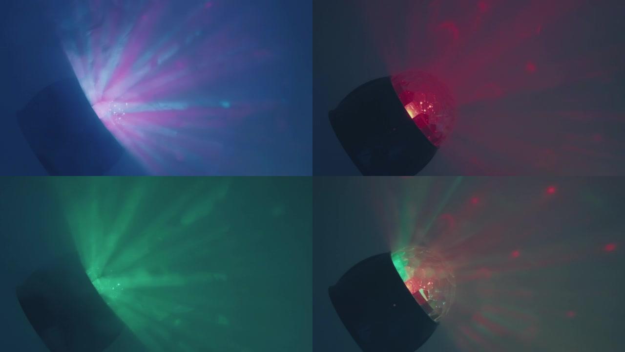 彩色，RGB彩色音乐球在迪斯科烟雾中闪耀着激光束