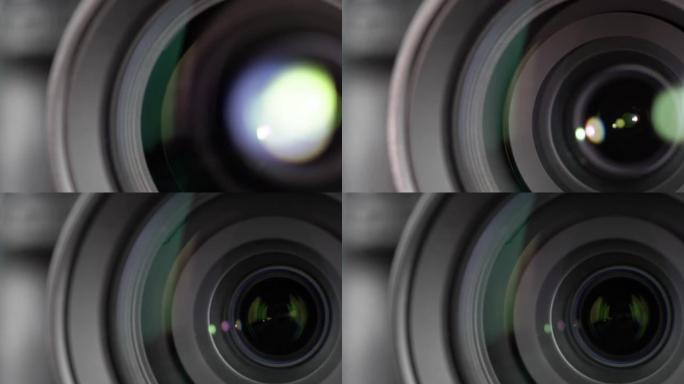 光学玻璃上有光斑的相机镜头的宏观拍摄。变焦相机镜头